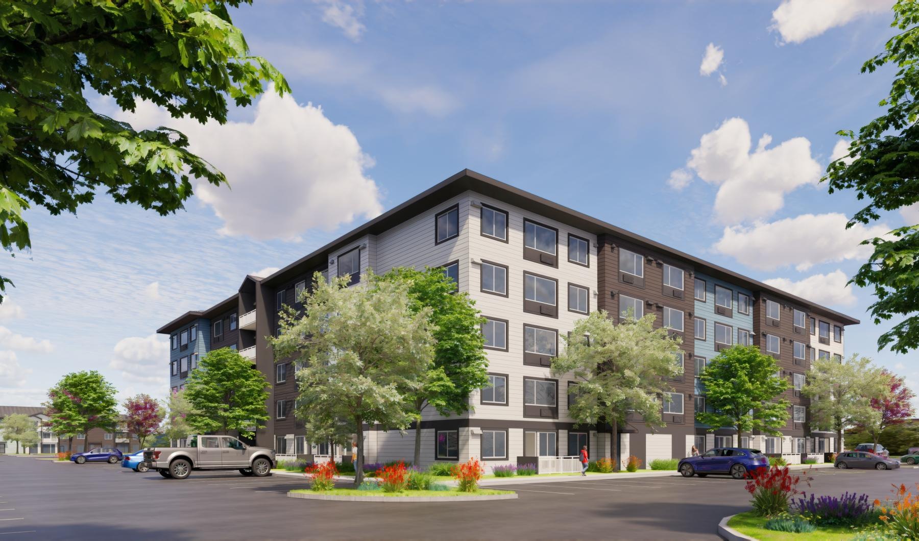 a building with trees and cars in front of it